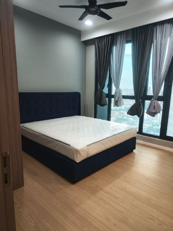 Bedroom in Bloomsvale KL with new light oak-look SPC flooring and floor-to-ceiling windows overlooking the city